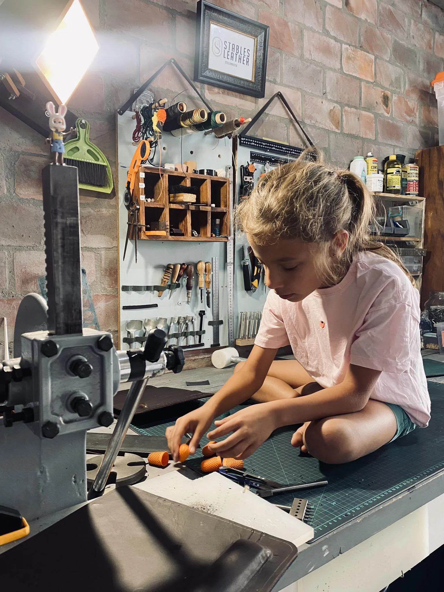 Maia crafting in the Stables Leather workshop