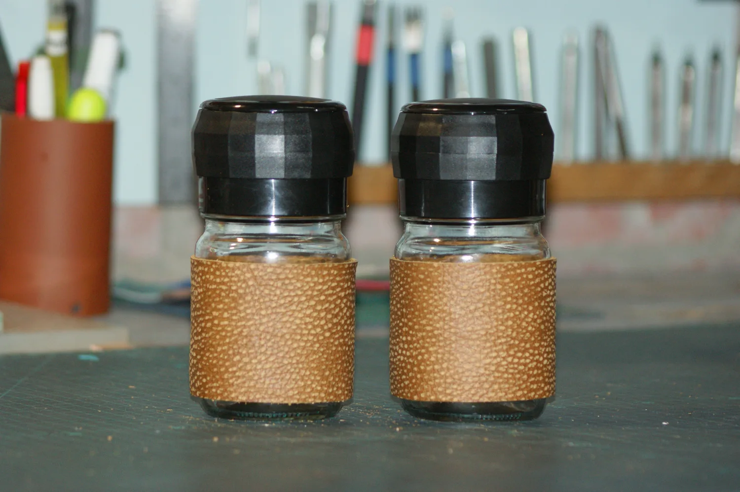 Leather-wrapped salt and pepper grinders