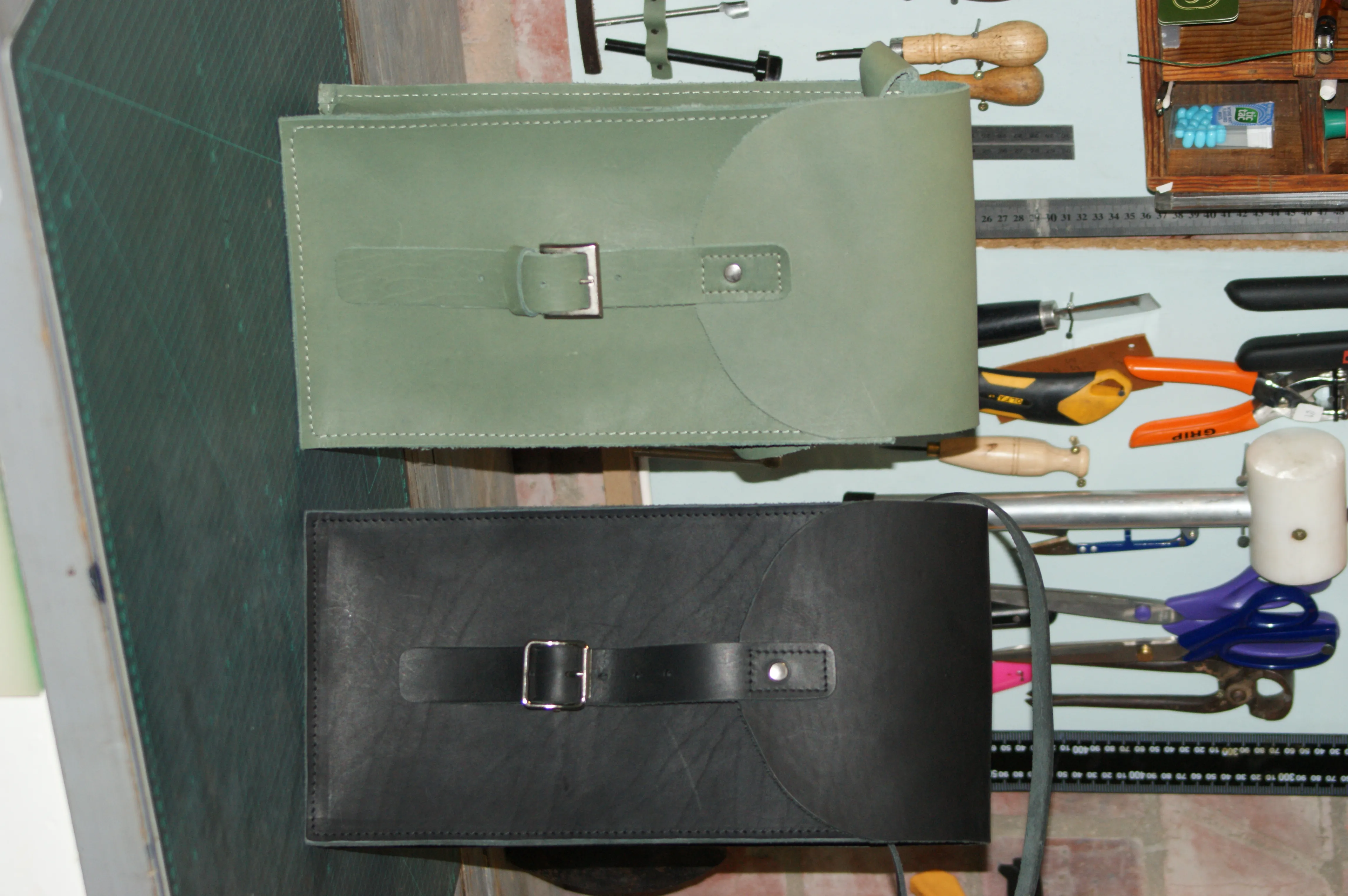 Leather document pouches in olive and black