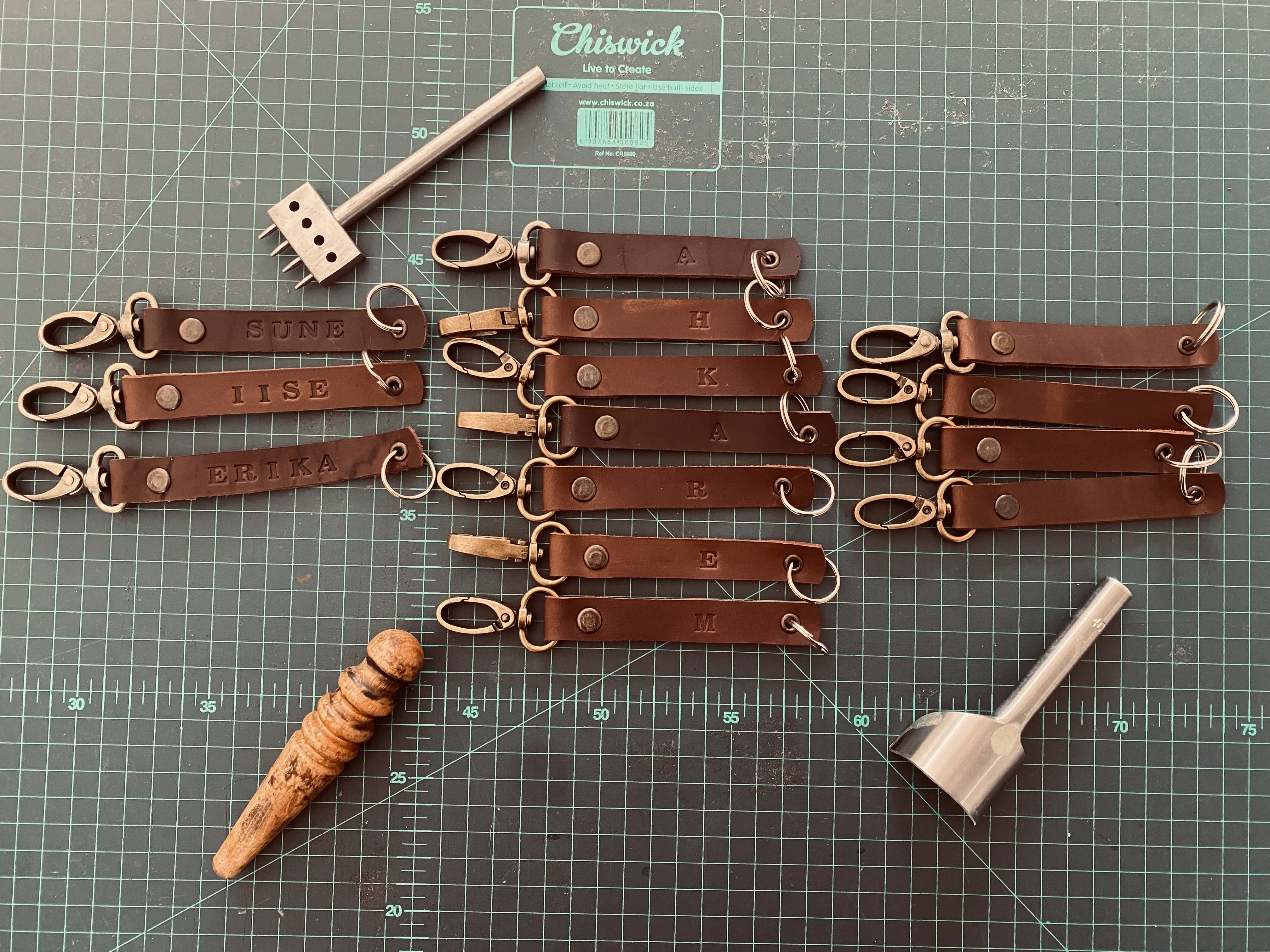 Personalised leather key tags on cutting mat